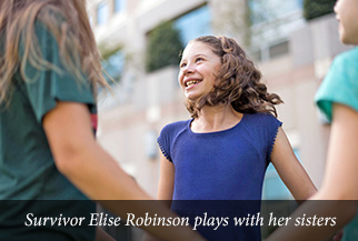 Survivor Elise Robinson plays with her sisters