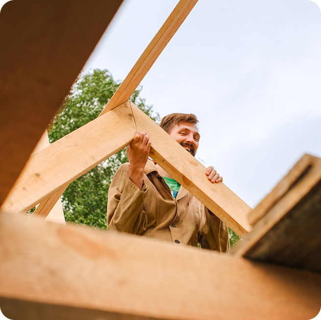 man volunteering to build a house