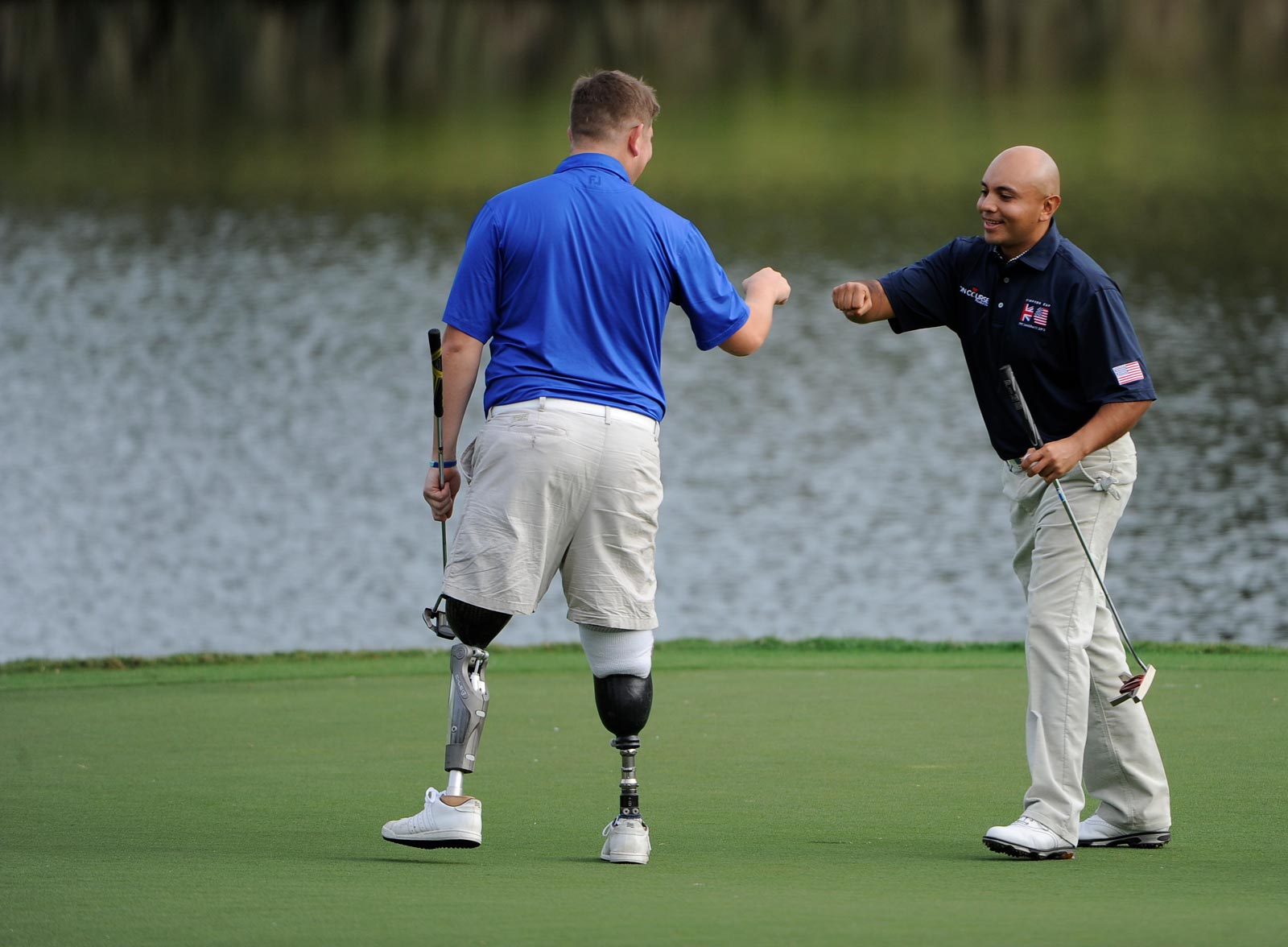 Simpson Cup veteran golfers giving knuckles