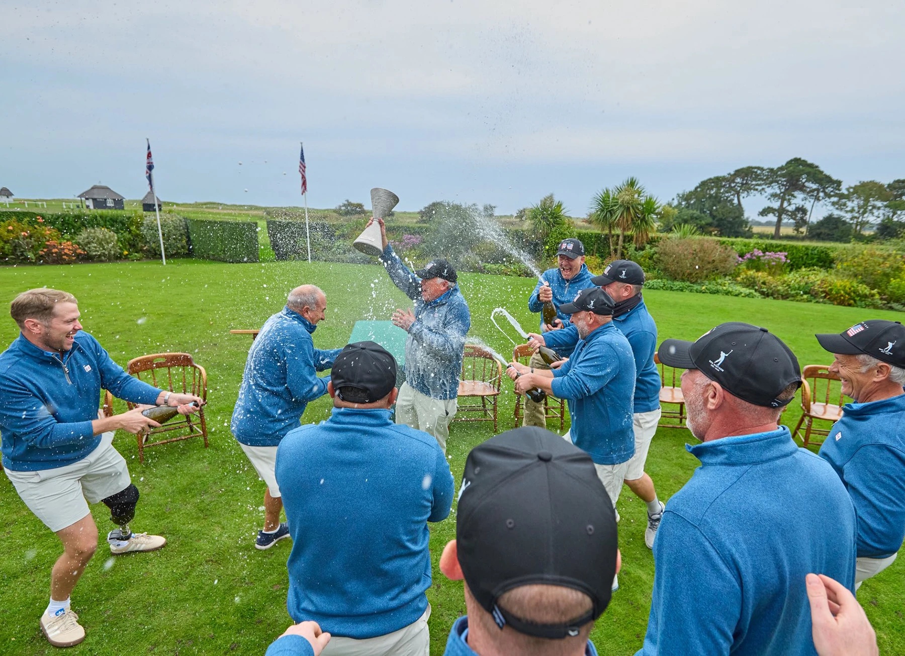group of military veteran golfers celebrating their Simpson Cup win