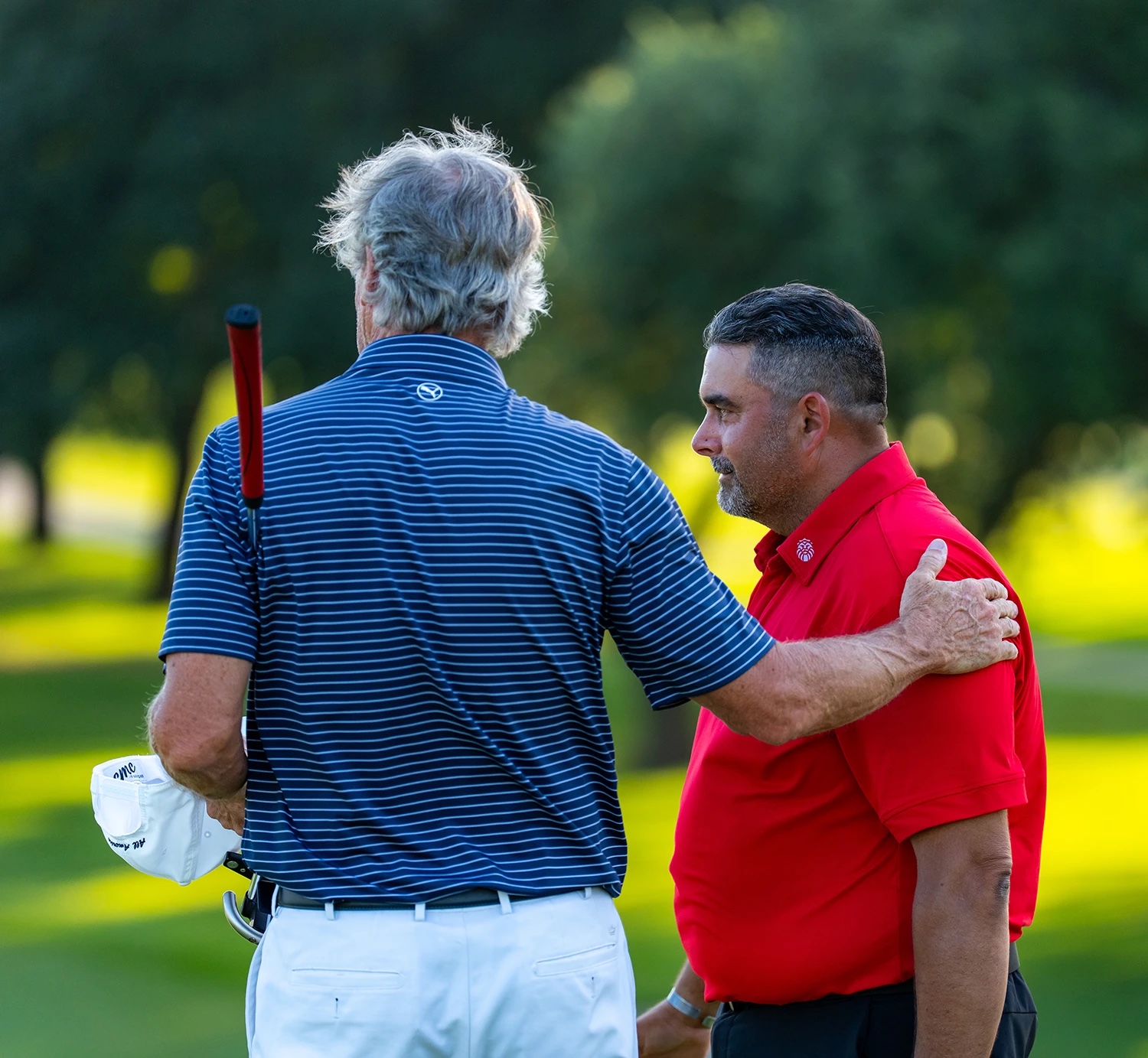 veteran amputees standing confidently on a golf course