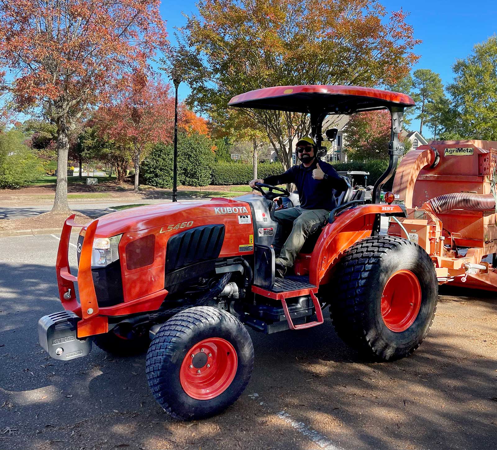 military veteran on a tractor at a golf course
