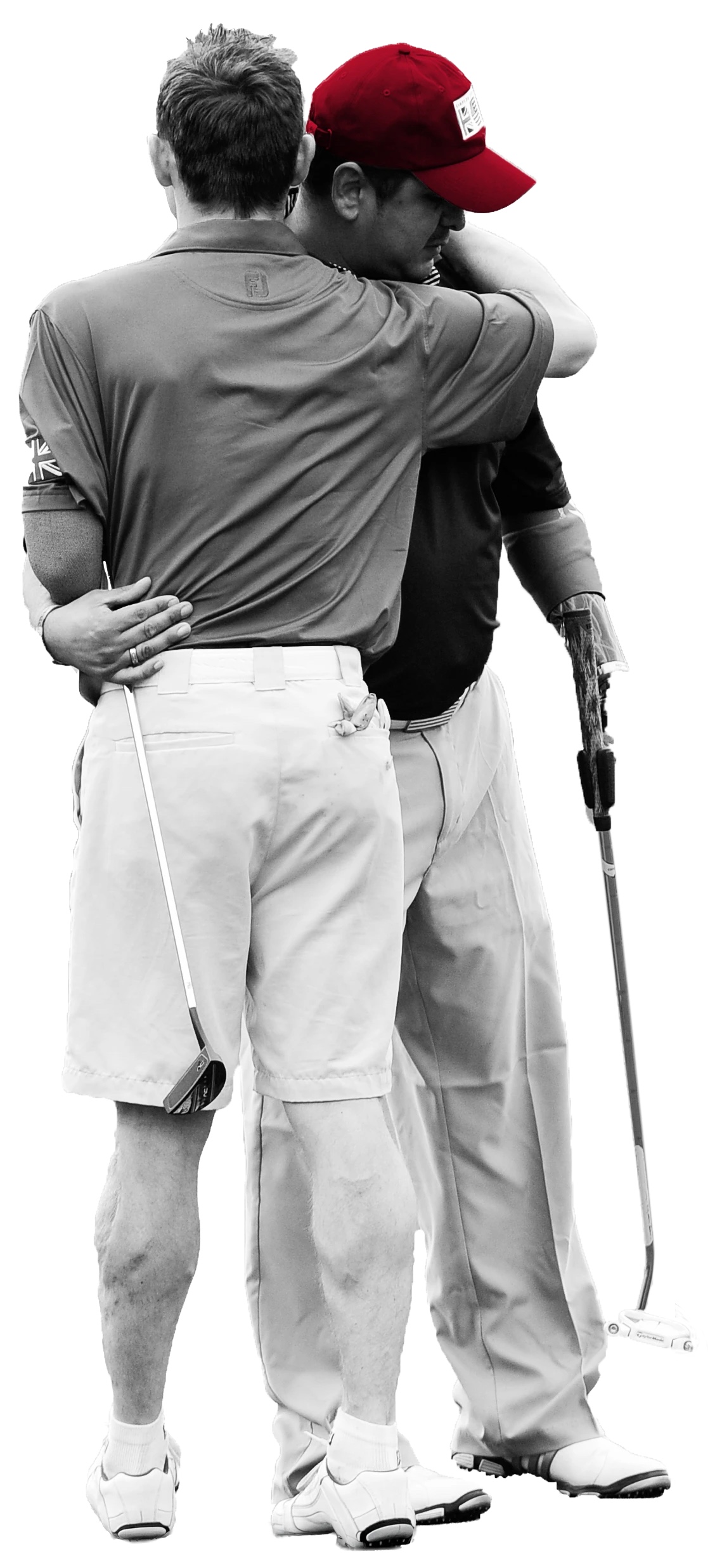 two veteran golfers hugging
