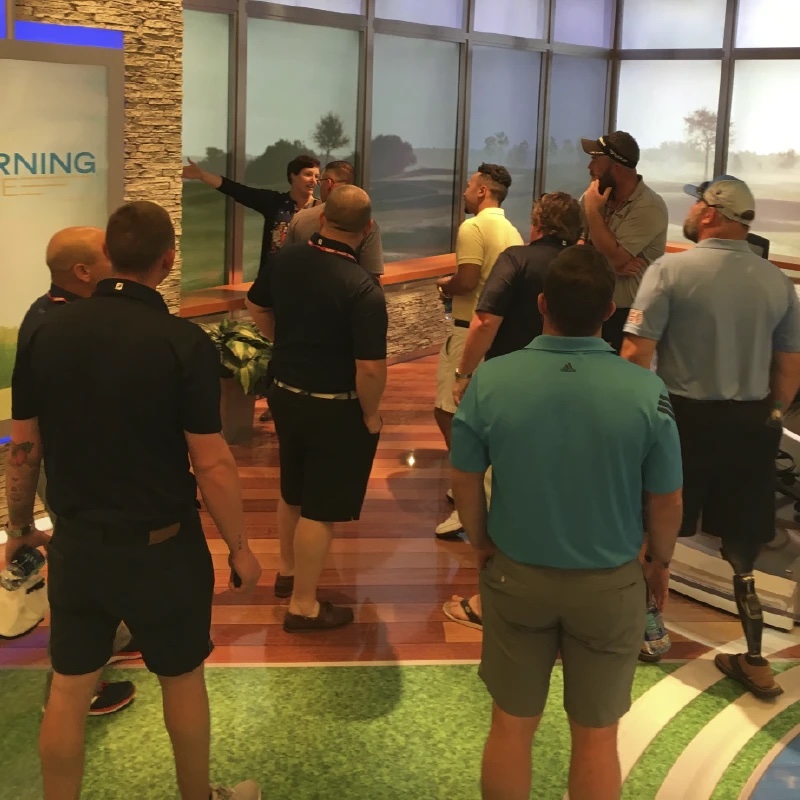 group of wounded veterans learning about a career in golf